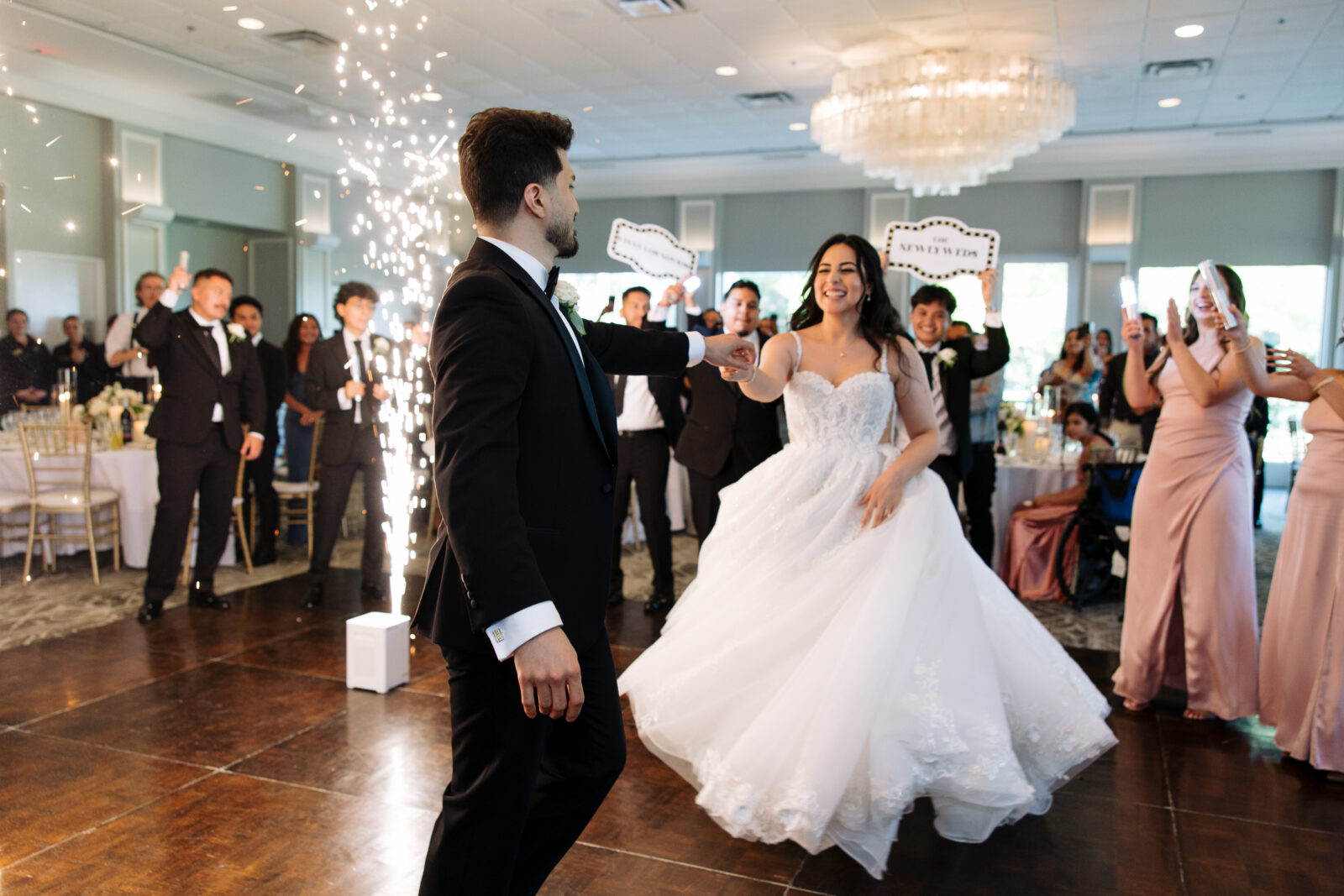 Bride and Groom welcomed by guests and bridal party during their grand entrance at The Grove Country Club.