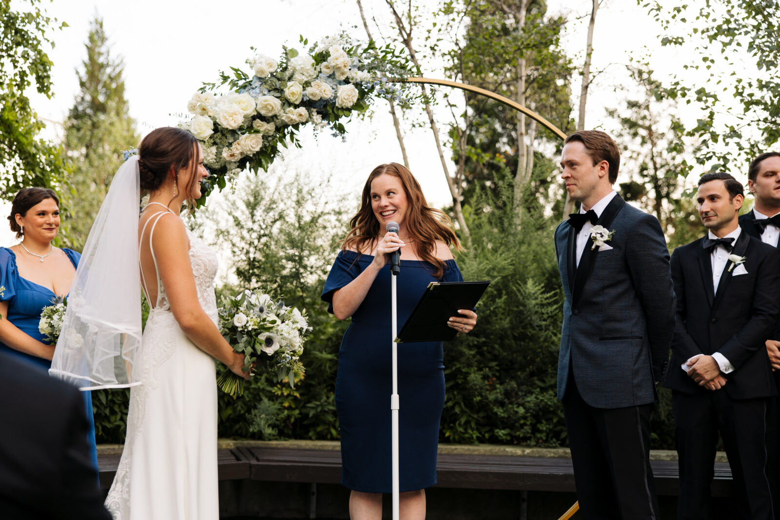 Bride and Groom standing at the alter during their ceremony on the Greenhouse Loft Outdoor Garden.
