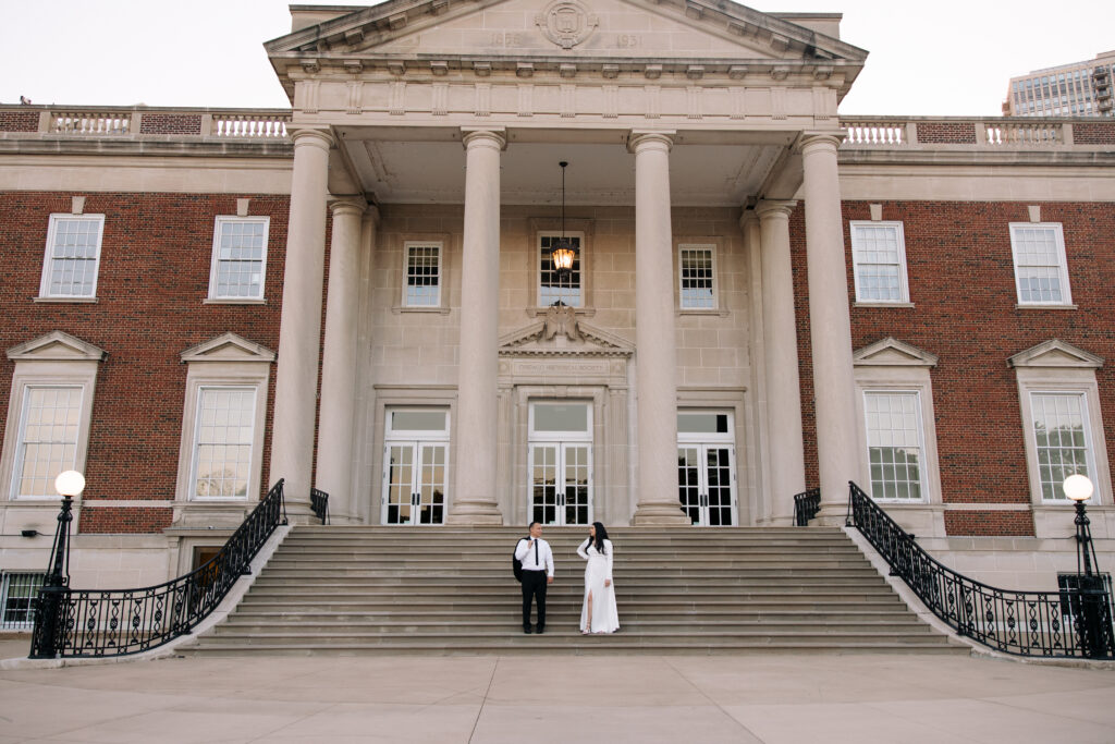 Bride and Groom standing in front of the Chicago History Museum on their beautiful grand staircase.